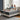 Couple relaxing on SpringFit Memory Foam Premium Mattress — man using tablet and woman reading a book — on a beige platform bed in a bright airy bedroom